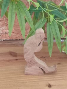Man on rock thinking wood carving HC003